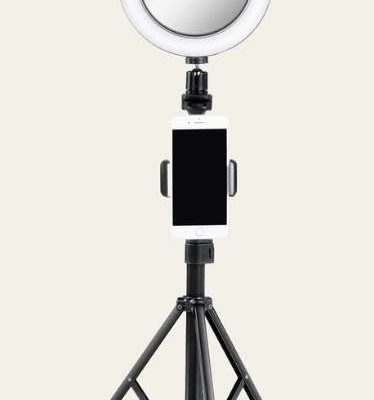 A picture showing a phone tripod with ring light.